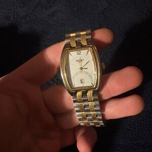 Elgin men's two-tone expansion watch with a white/silver dial and date window